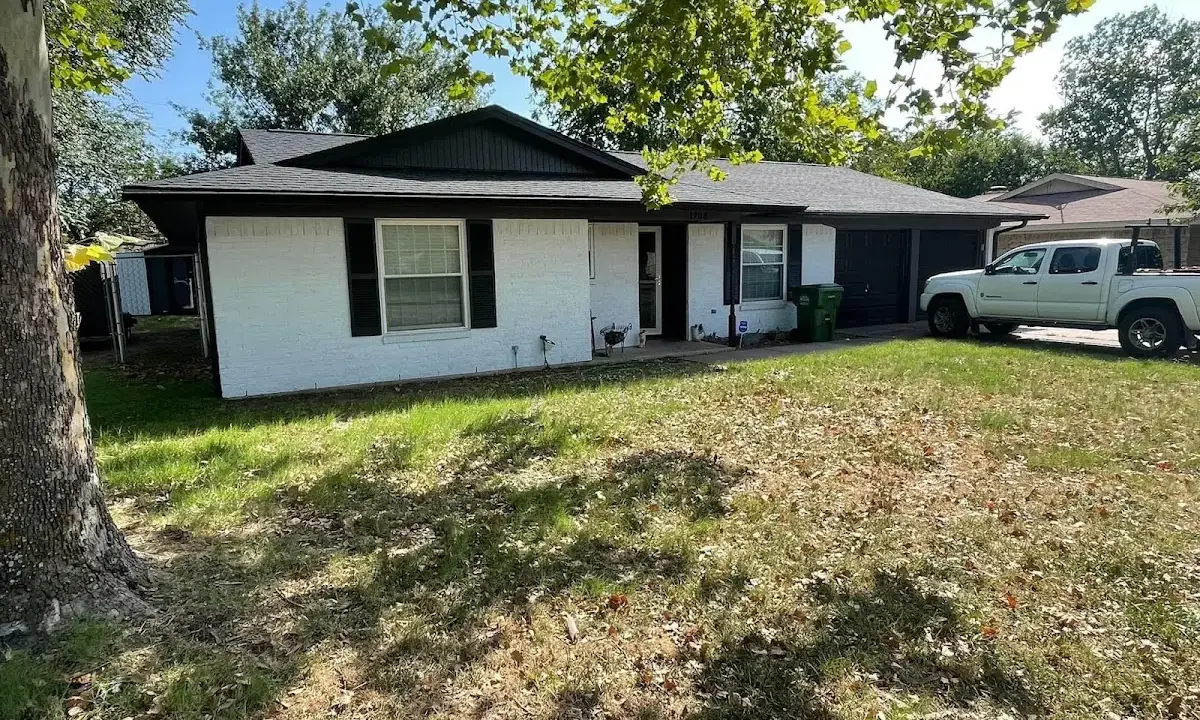 Professional roofing crew working on a residential roof in Devils Lake
